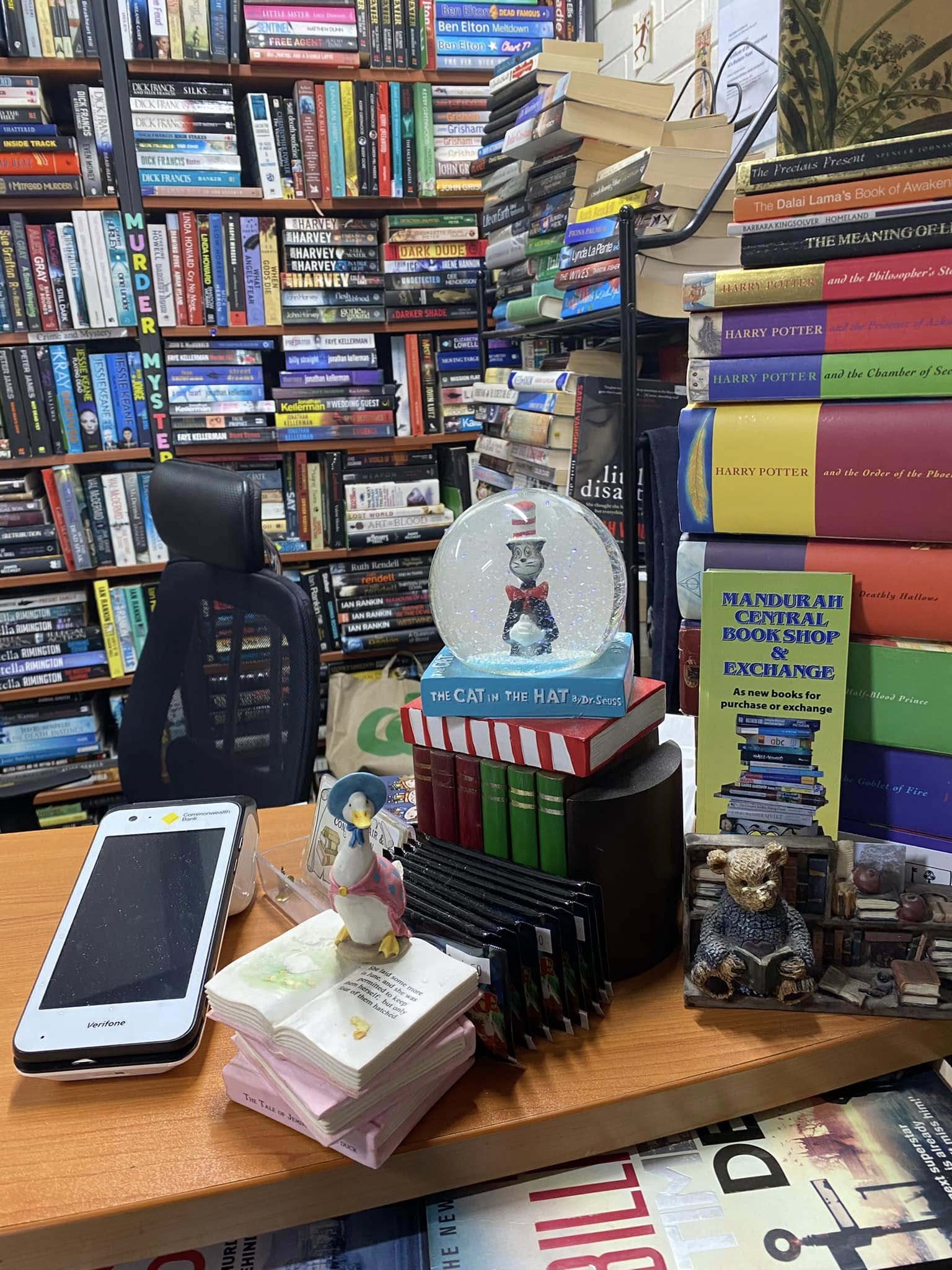 The friendly front counter with whimsical book curios